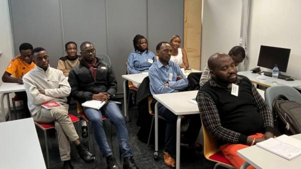 A group of people in a classroom.
