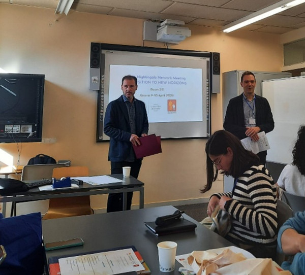 A man speaking in front of an audience.