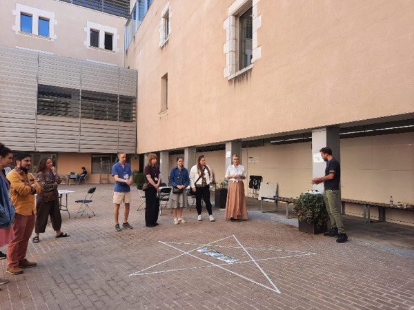 A workshop in session outdoors.